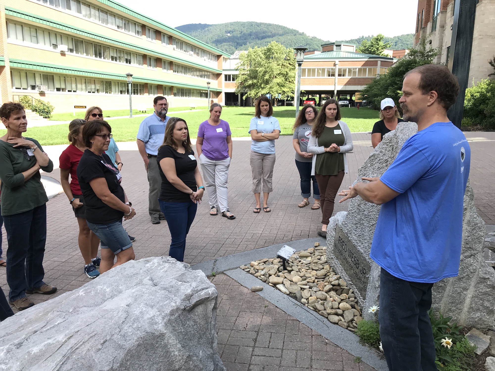 Dr. Heckert gives the teachers a tour of the Rock Garden