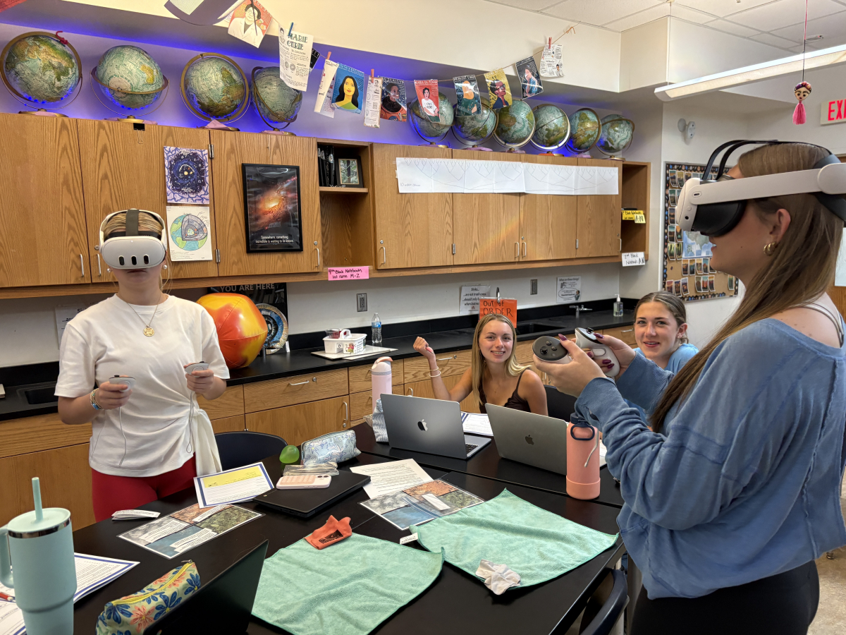 Students in class using the VR headsets