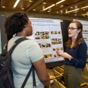 Klyce speaks with fellow GES major Neeshell Bradley-Lewis at OSR poster day