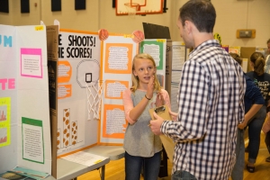 Dr. Bob Swarthout talks with Blue Ridge Elementary student about her science project.  Photo by Ellen Gwin Burnette