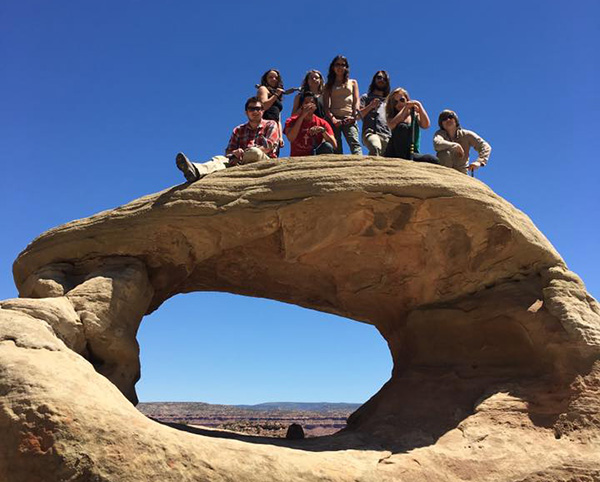 Students on arch on Triassic Trip