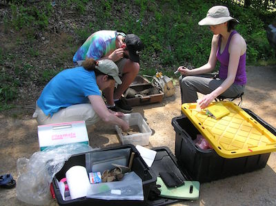 Dr. Cowan and students in field
