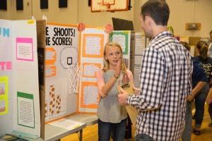 Dr. Bob Swarthout talks with Blue Ridge Elementary student about her science project. Photo by Ellen Gwin Burnette
